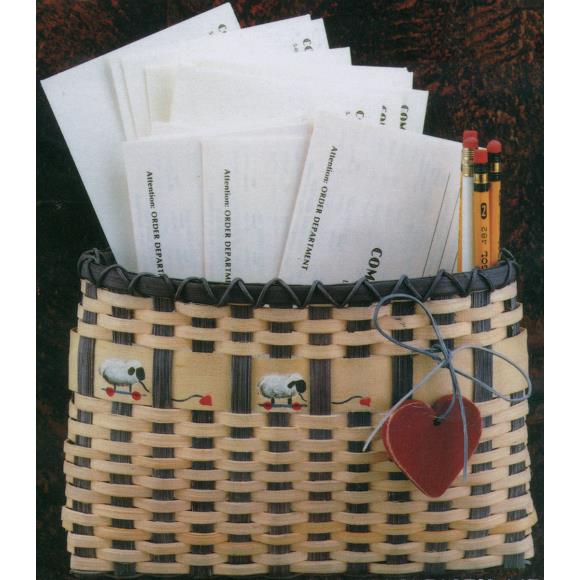Close up of the wall basket with little sheep and hearts, containing letters and pencils